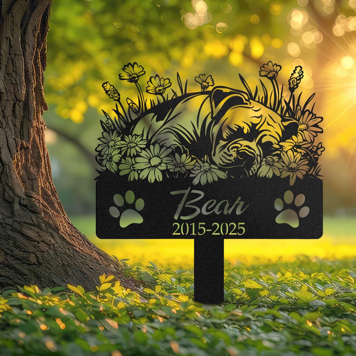 Pitbull pet grave marker displayed outdoors in a garden setting, showing the personalized angel wings and daisy floral design in place on the stake.