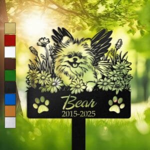 Pomeranian silhouette with angel wings surrounded by a daisy floral border on a personalized metal garden stake, with paw print cutouts at the base.