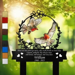 Pair of orange-breasted robins inside a floral wreath on a personalized metal garden stake, engraved with a memorial verse and name plate.