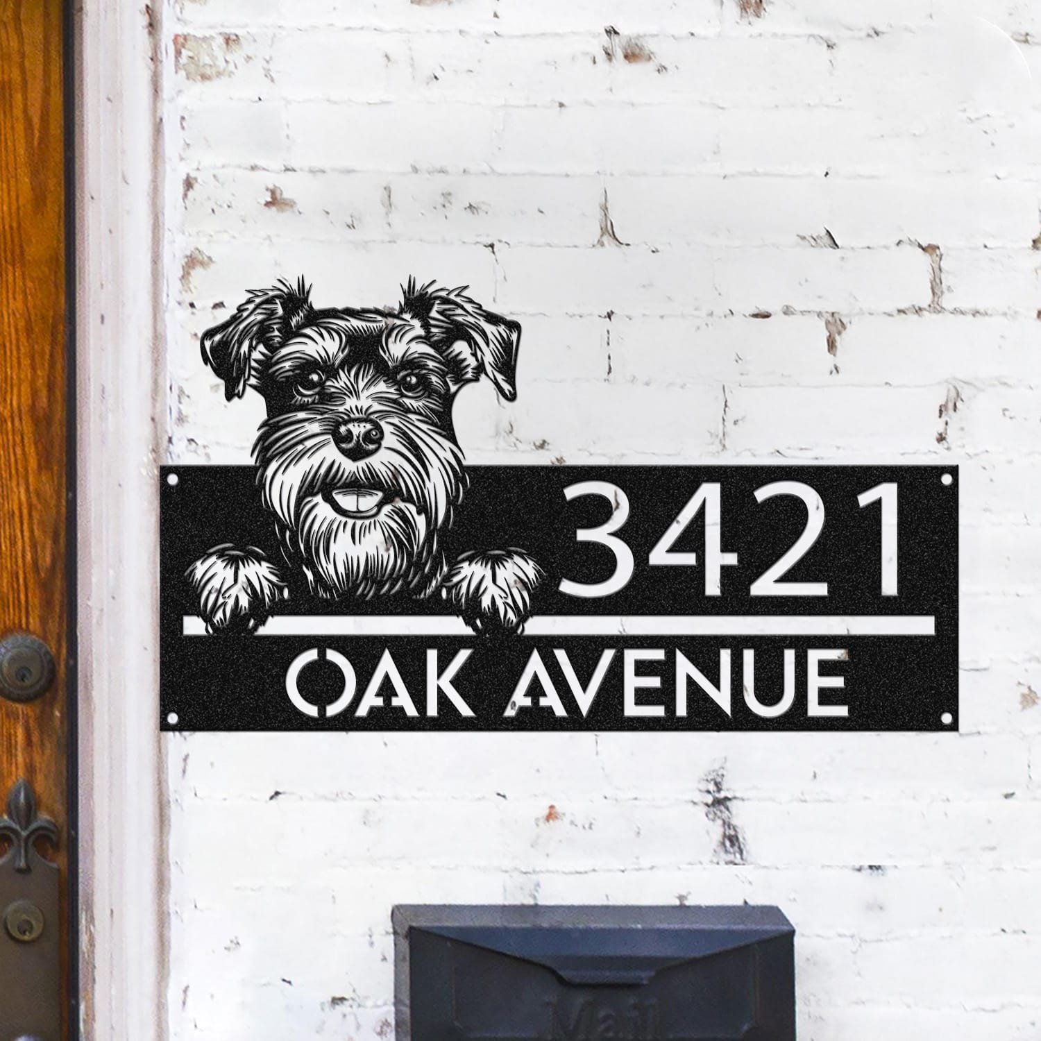 Schnauzer peeking over a compact horizontal address sign reading 3421 Oak Avenue