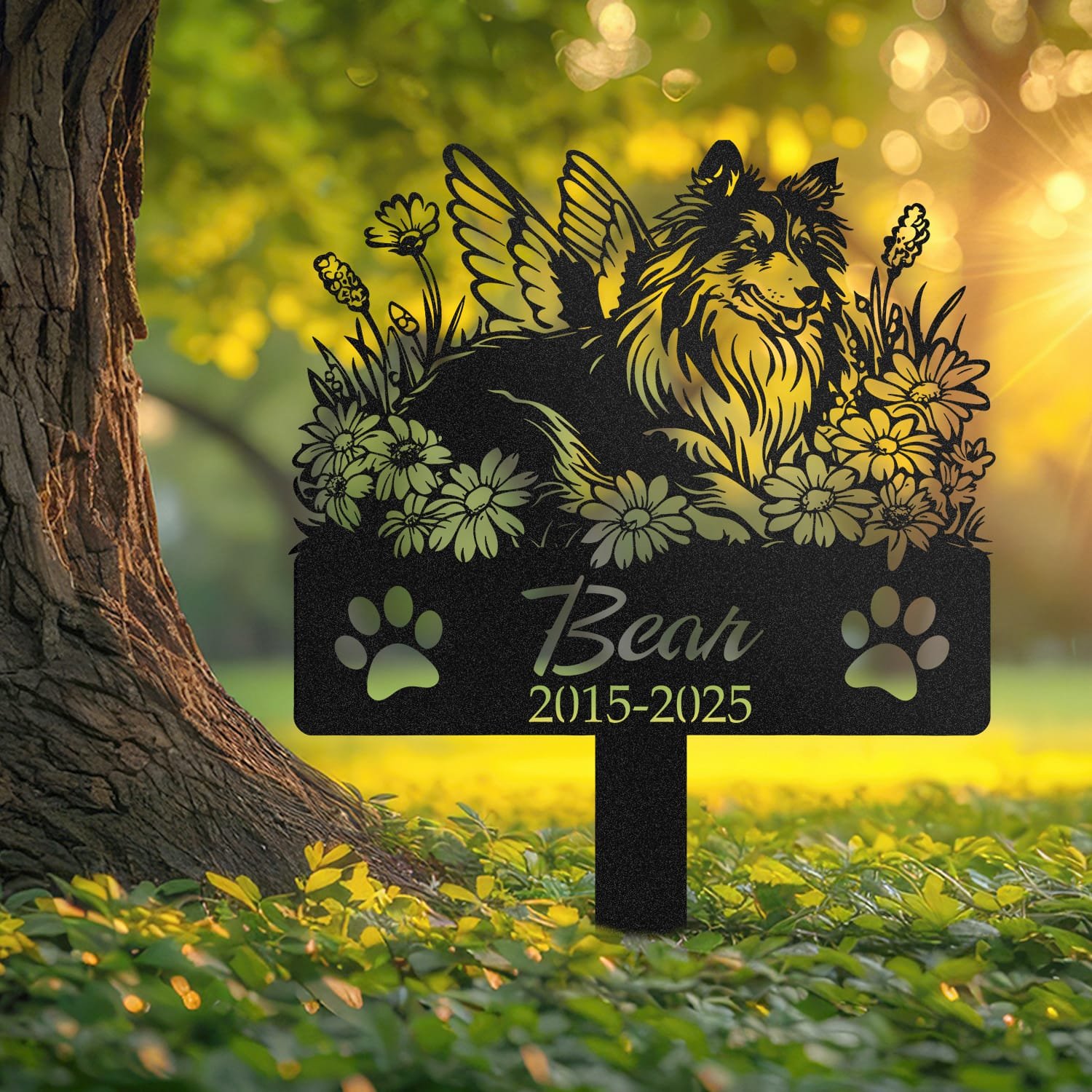 Shetland Sheepdog pet grave marker displayed outdoors in a garden setting, showing the personalized angel wings and daisy floral design in place on the stake.