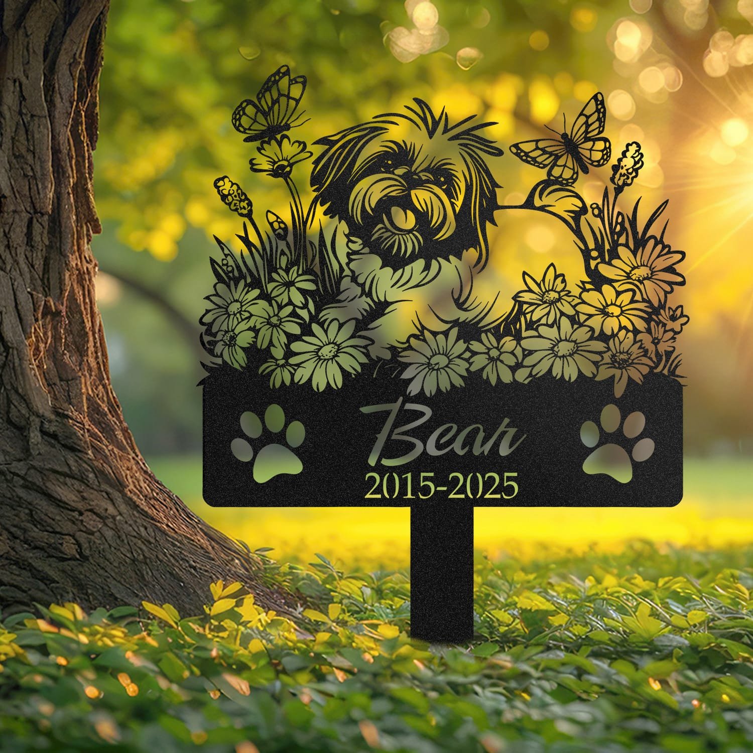 Shih Tzu pet grave marker displayed outdoors in a garden setting, showing the personalized daisy garden design with butterflies in place on the stake.