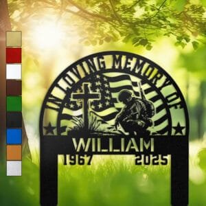 Metal memorial design of a soldier kneeling at a wooden cross, framed by a waving American flag, set within an arched, star-accented frame and engraved with 'In Loving Memory Of', personalized with a name and memorial years.