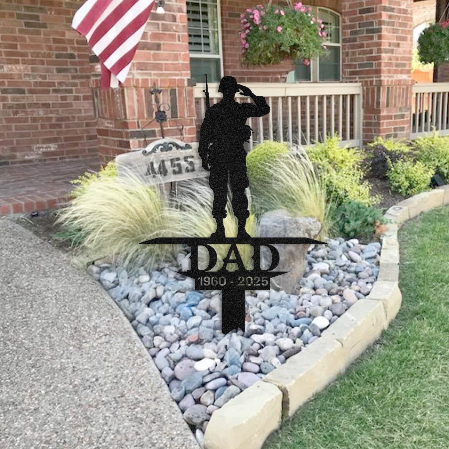 Soldier human grave marker staged near a home entryway, showing the finished design and personalization outdoors.