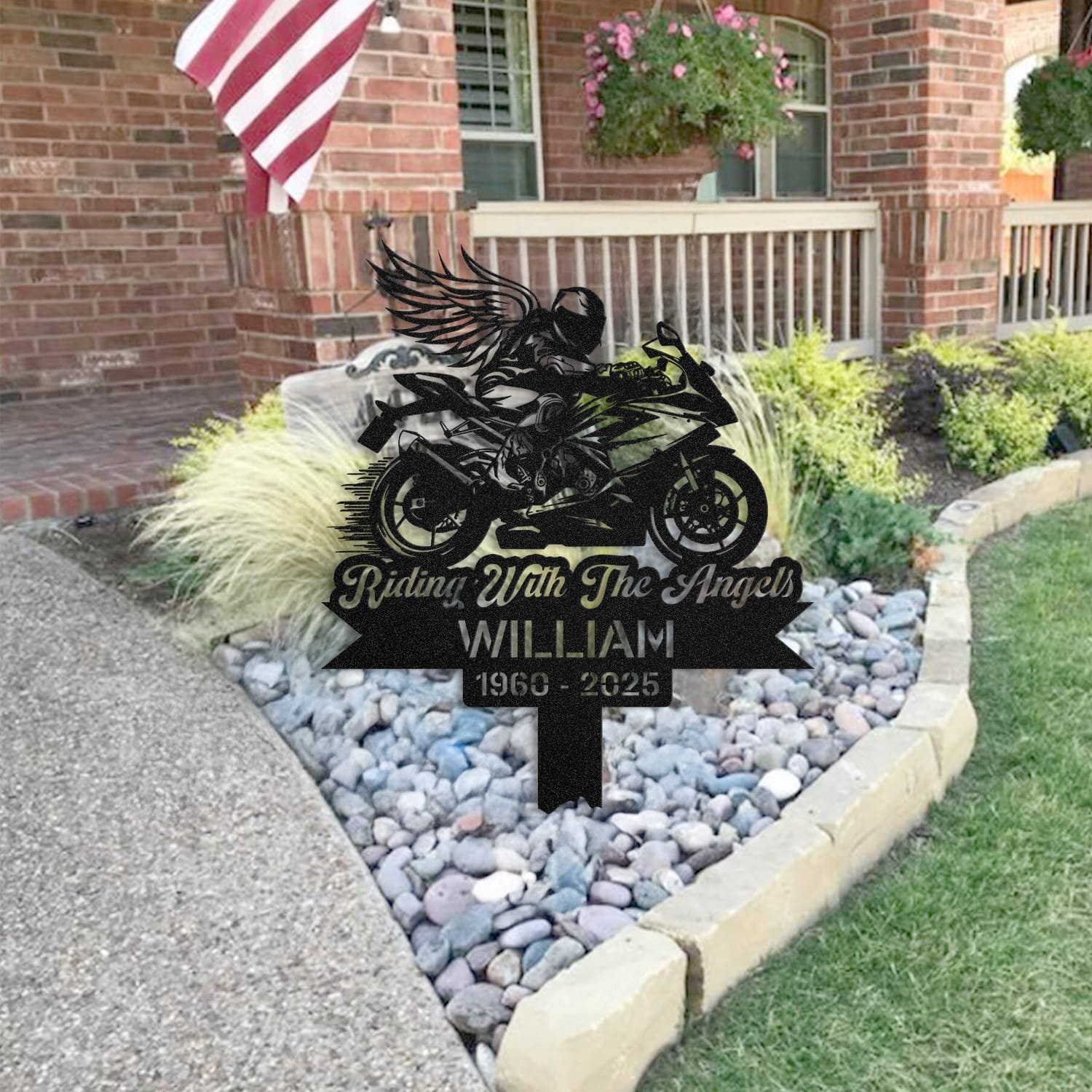 Sport Motorcycle human grave marker staged near a home entryway, showing the finished sport motorcycle winged rider design and name plate outdoors.
