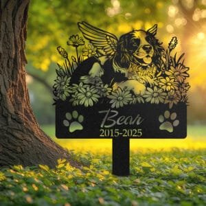 Springer Spaniel silhouette with angel wings surrounded by a daisy floral border on a personalized metal garden stake, with paw print cutouts at the base.