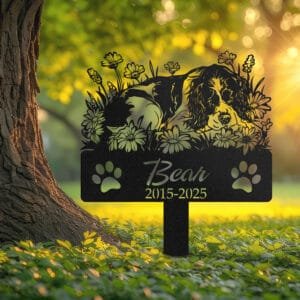 Springer Spaniel resting in a peaceful sleeping pose within a daisy floral border on a personalized metal garden stake, with paw print cutouts at the base.