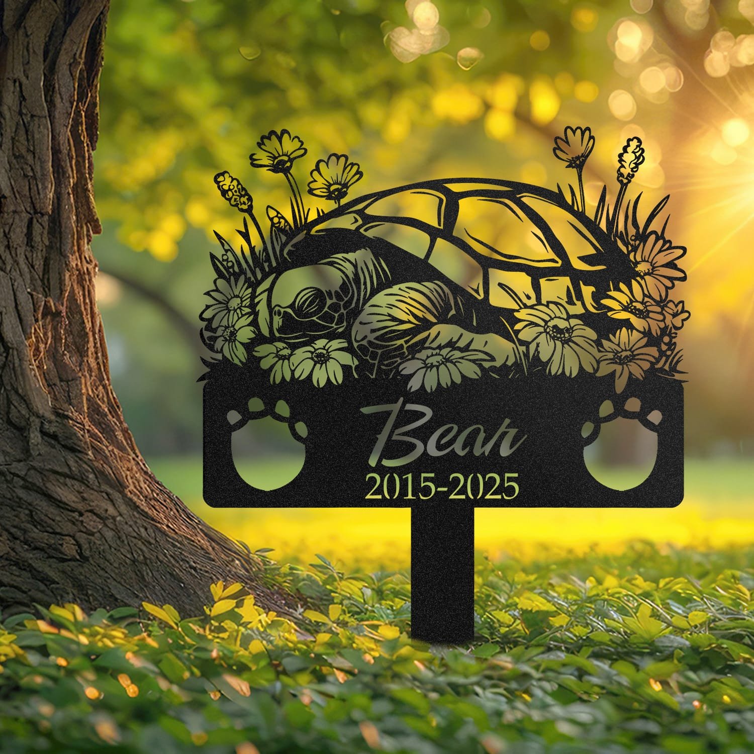 Turtle pet grave marker displayed outdoors in a garden setting, showing the personalized sleeping-pose daisy floral design in place on the stake.