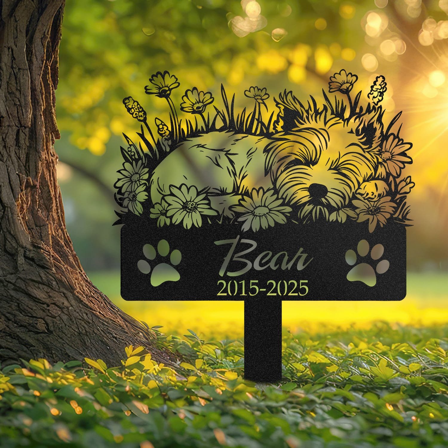 West Highland White Terrier pet grave marker displayed outdoors in a garden setting, showing the personalized sleeping-pose daisy floral design in place on the stake.