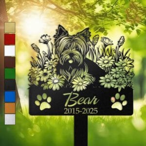 Yorkshire Terrier silhouette with angel wings surrounded by a daisy floral border on a personalized metal garden stake, with paw print cutouts at the base.
