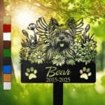 Yorkshire Terrier silhouette with angel wings surrounded by a daisy floral border on a personalized metal garden stake, with paw print cutouts at the base.