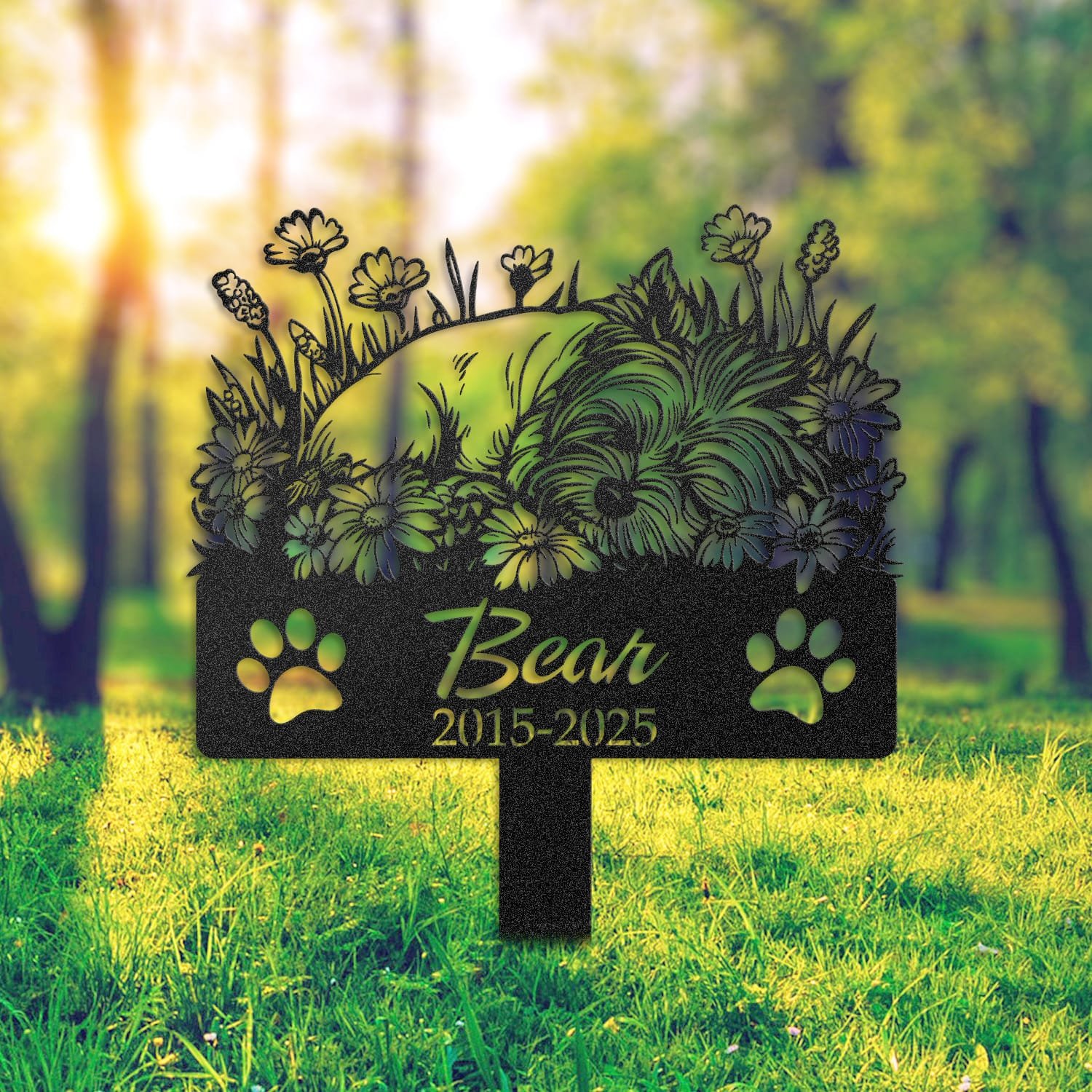 Yorkshire Terrier pet grave marker staged near a home entryway, showing the finished sleeping-pose daisy floral design and name plate outdoors.