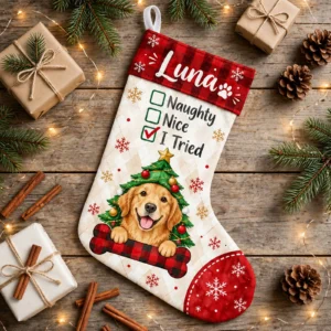 personalized i tried tree dog stocking shown laid flat on a wooden surface beside wrapped gifts and greenery